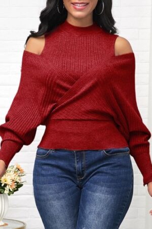 A woman wearing jeans and red sweater.